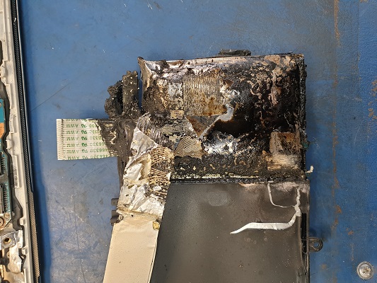 laptop lithium battery explosion. This is the after math of a laptop battery exploding and what the battery looks like after it has got on fire.